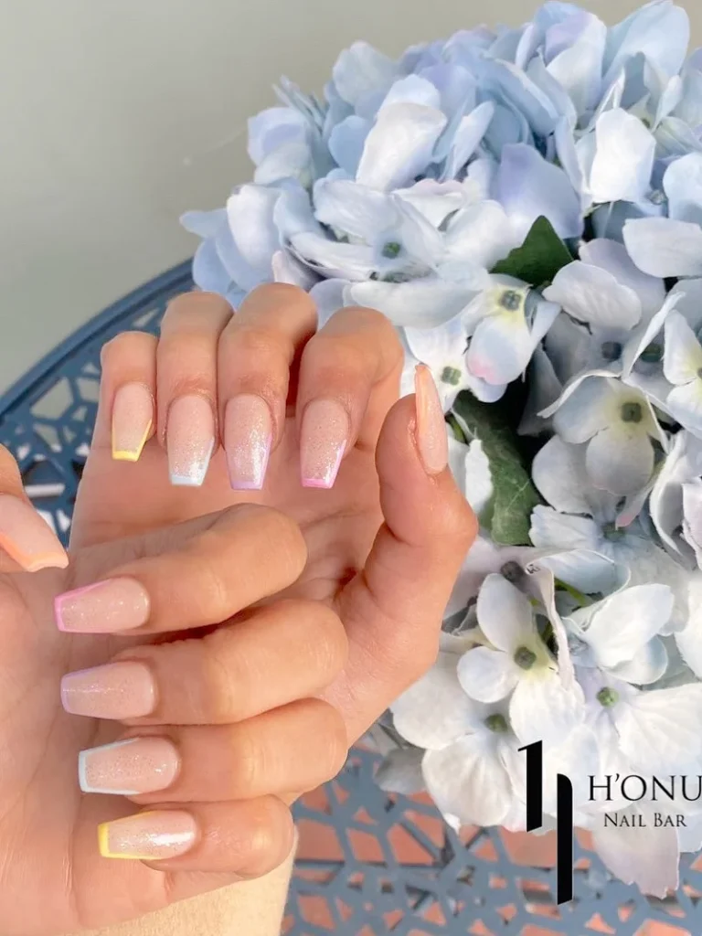 pastel french tip nails with glossy gel manicure in soft colors at honu nails