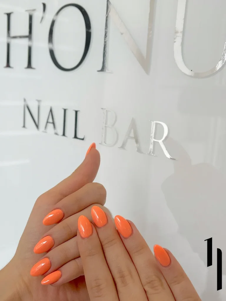 orange gel manicure nails at honu nail salon with glossy finish