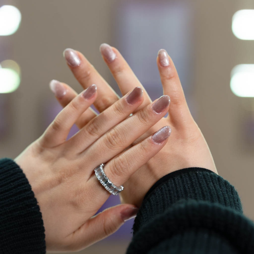 Nude shimmer gel nails at H’ONU with glossy finish and soft sparkle for an elegant natural look